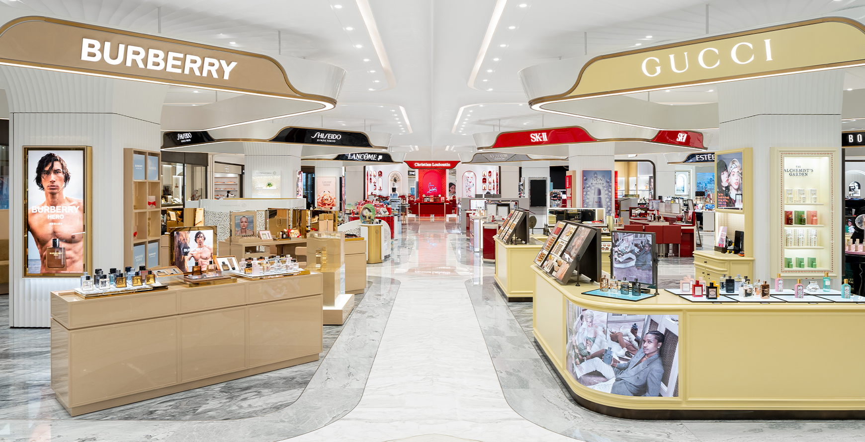 SKP Chengdu beauty hall interior with Burberry and Gucci counters, illuminated brand signage and polished marble flooring.