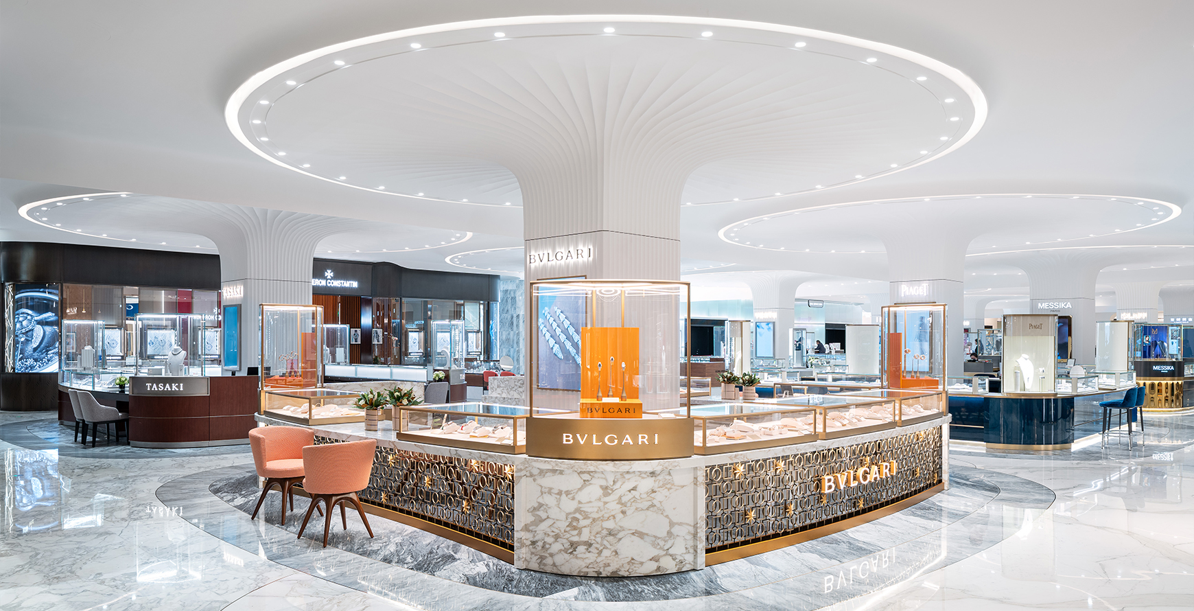 Bulgari jewellery concession inside SKP Chengdu, with illuminated display cases, sculpted white ceilings and polished marble flooring.