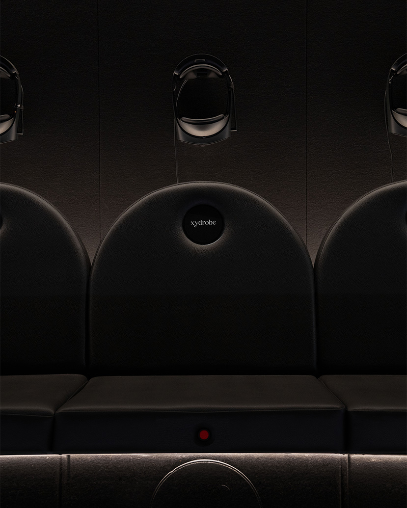 A Xydrobe headset detail at Harrods, set within a dark, immersive environment that frames digital experience as a precise, sensory extension of luxury retail.